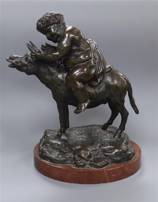 A 19th century bronze of Bacchus riding a donkey, rouge marble base H.22cm